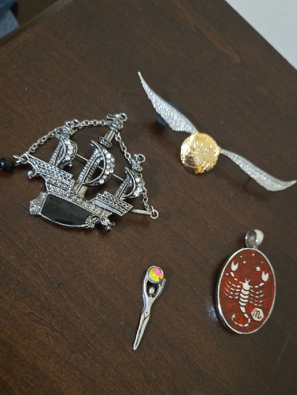 Random Assortment Of Pins And Pendants